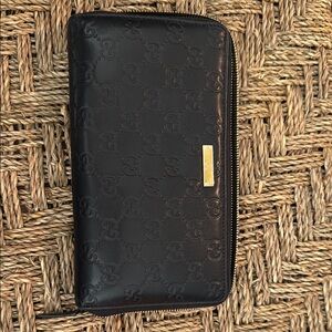 Gucci Black Embossed Leather Zip Wallet with Gold Accent